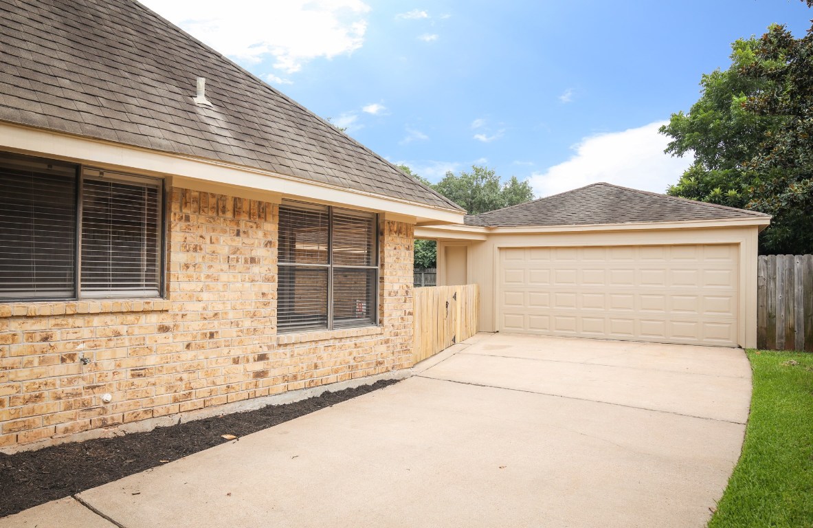 3003 Planters Street Sugar Land, TX 77479 - Photo 16 of 40 a front view of a house with a garage