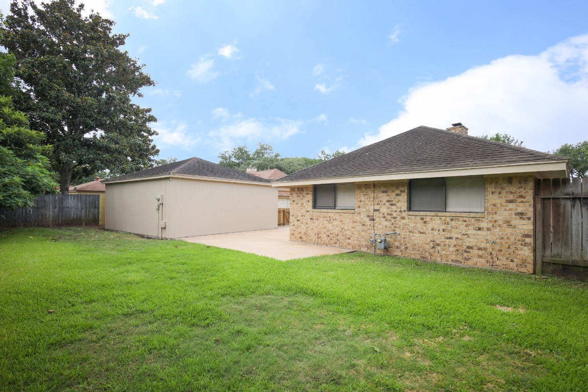 3003 Planters Street Sugar Land, TX 77479 - Photo 20 of 40 a front view of house with a garden and yard