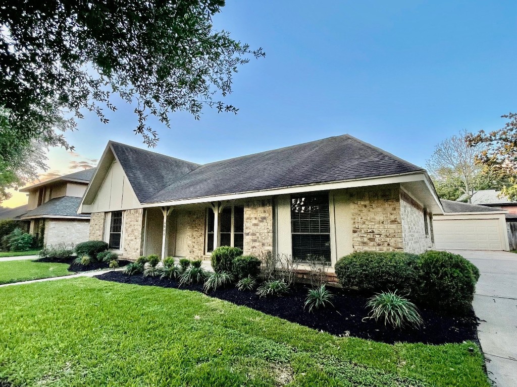 3003 Planters Street Sugar Land, TX 77479 - Photo 2 of 40 a front view of a house with a yard