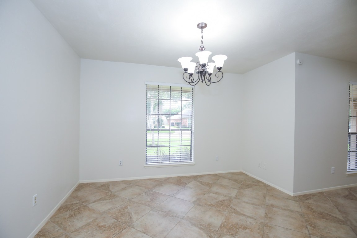 3003 Planters Street Sugar Land, TX 77479 - Photo 30 of 40 wooden floor in an empty room with a window