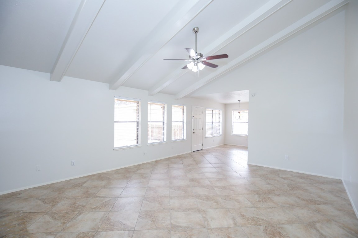 3003 Planters Street Sugar Land, TX 77479 - Photo 32 of 40 an empty room with chandelier fan and windows