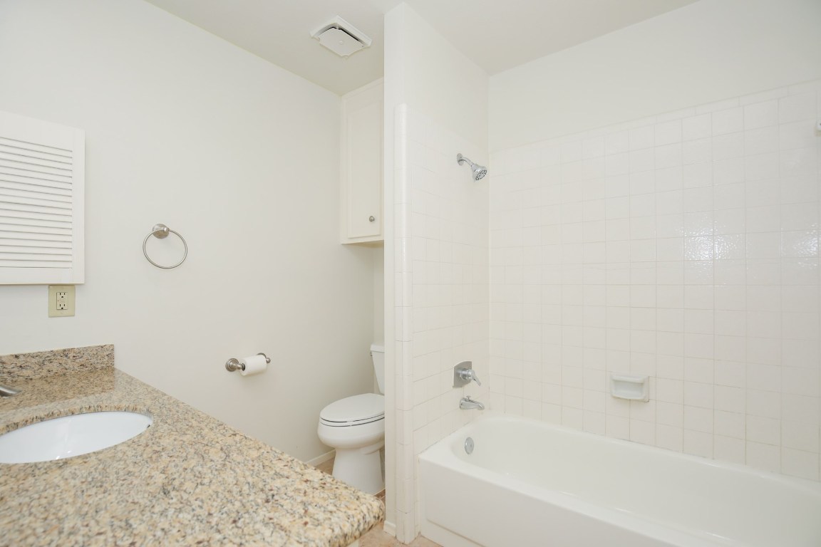 3003 Planters Street Sugar Land, TX 77479 - Photo 37 of 40 a bathroom with a granite countertop bathtub shower sink vanity and toilet