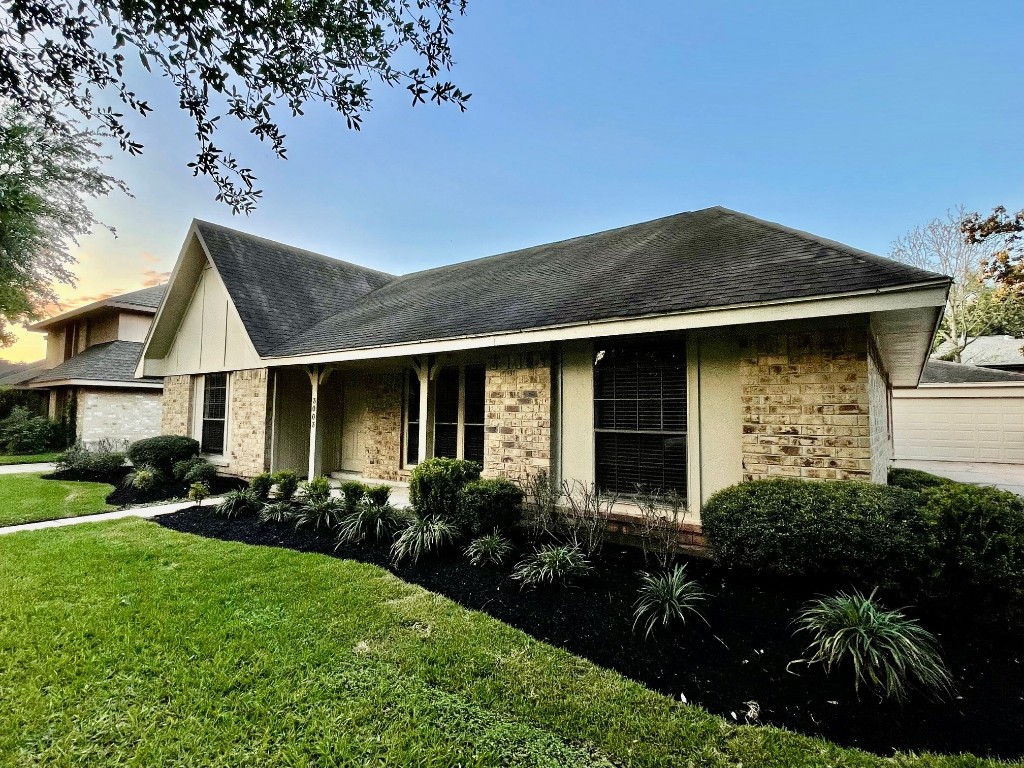 3003 Planters Street Sugar Land, TX 77479 - Photo 40 of 40 a front view of a house with garden