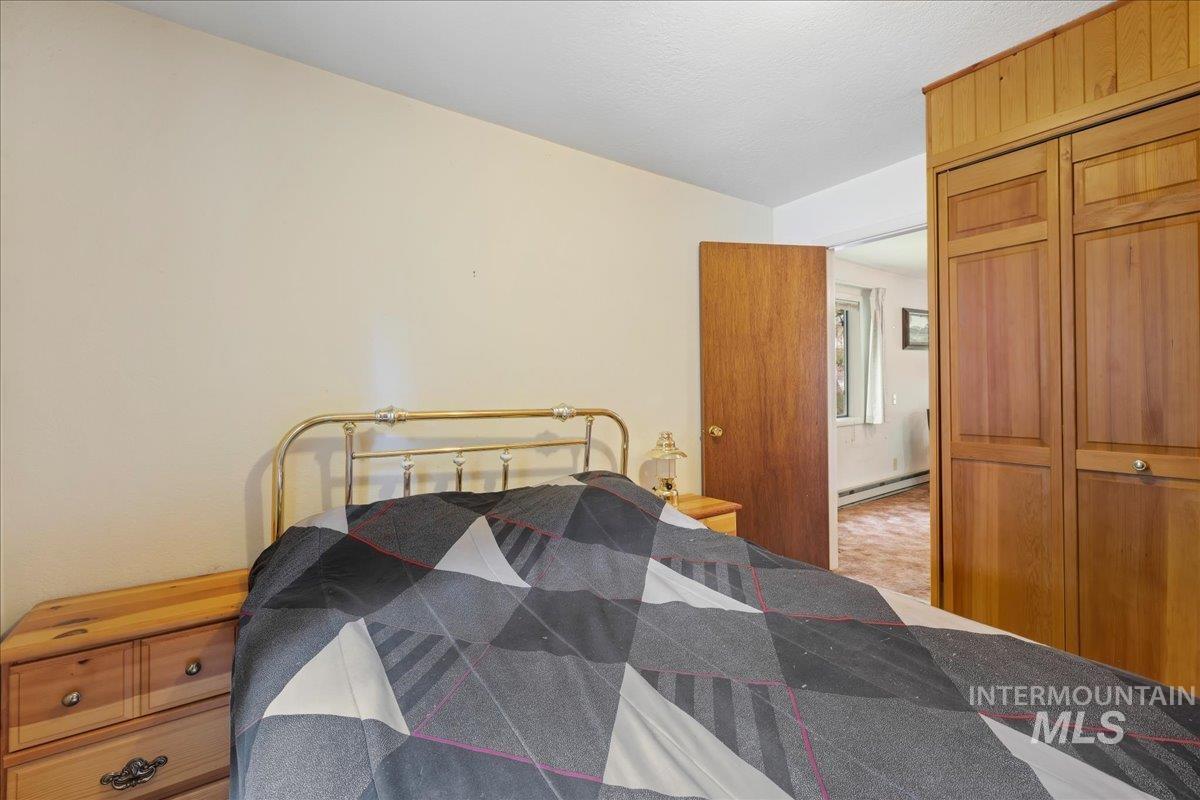 815 Reedy Lane McCall, ID 83638 - Photo 12 of 22 Bedroom featuring a closet and baseboard heating