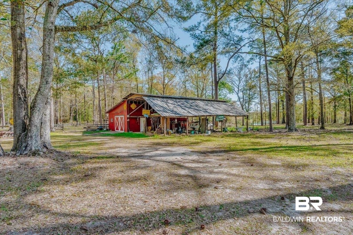 14160 Moffett Road Wilmer, AL 36587 - Photo 56 of 75 View of barn featuring dirt driveway
