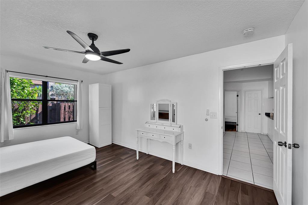 2698 North Nob Hill Road Sunrise, FL 33322 - Photo 15 of 27 a living room with hardwood floor and a ceiling fan