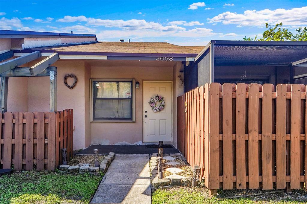 2698 North Nob Hill Road Sunrise, FL 33322 - Photo 20 of 27 a front view of house with a garden