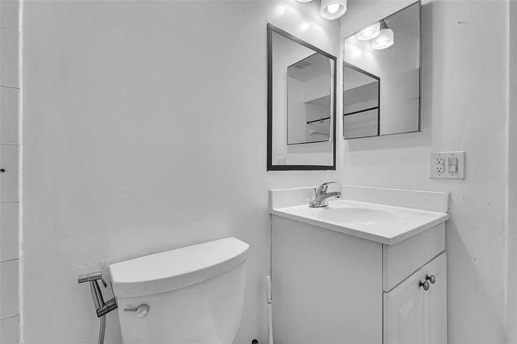 2698 North Nob Hill Road Sunrise, FL 33322 - Photo 10 of 27 a bathroom with a sink and a toilet