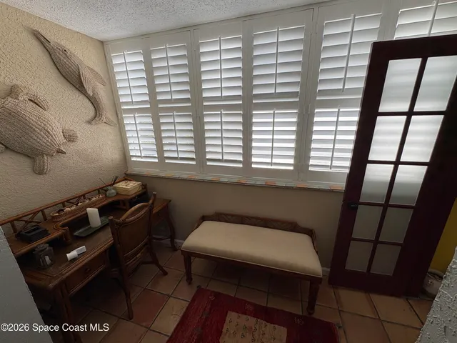 a bathroom with a toilet a sink and a window