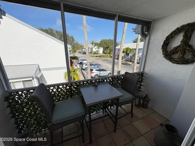 a table and chairs in a balcony