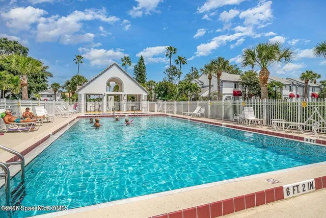 a view of a house with a yard from a balcony