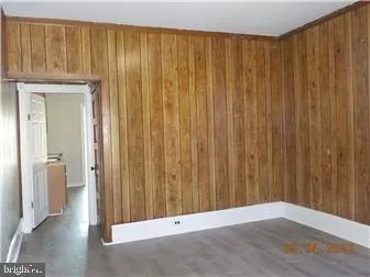 a view of a porch with wooden floor