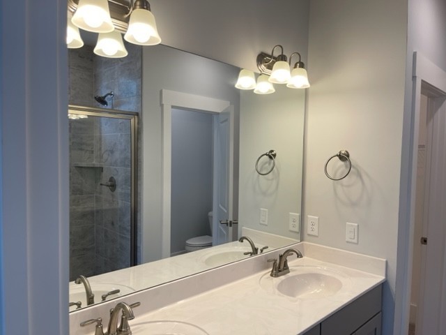 525 Black Tea Way Franklin, TN 37064 - Photo 11 of 51 a bathroom with a sink vanity and a mirror