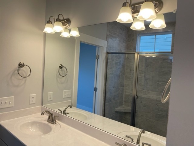 525 Black Tea Way Franklin, TN 37064 - Photo 16 of 51 a bathroom with a sink vanity and shower