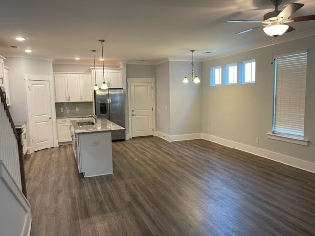 525 Black Tea Way Franklin, TN 37064 - Photo 21 of 51 a open kitchen with white cabinets and stainless steel appliances