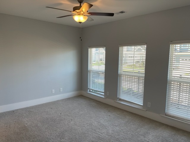 525 Black Tea Way Franklin, TN 37064 - Photo 8 of 51 an empty room with windows and fan