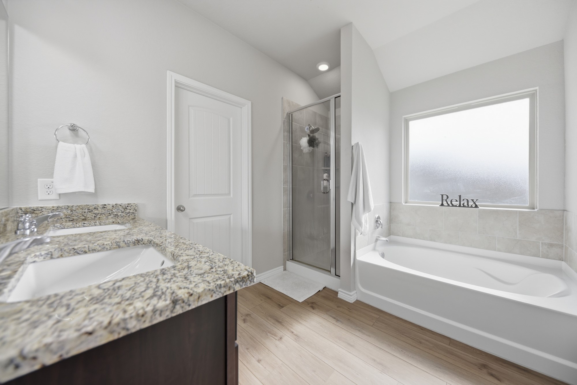 803 Davy Street Brenham, TX 77833 - Photo 15 of 26 Primary Bathroom with soaking tub, stall shower and extra large walk-in closet.