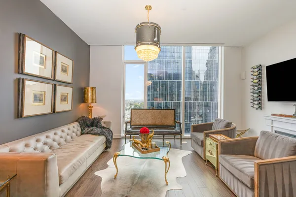 a living room with furniture and a flat screen tv