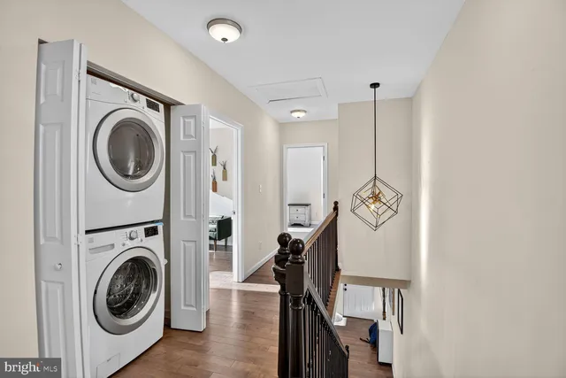 a view of a storage and utility room with a washer dryer