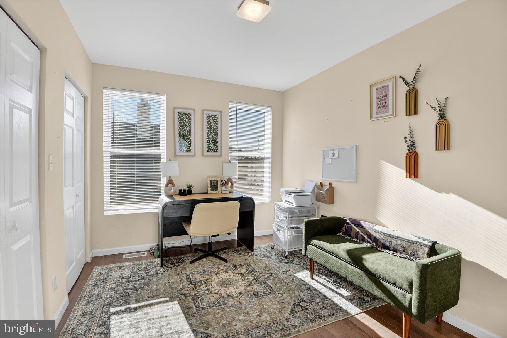 4321 Minnesota Avenue Northeast Washington, DC 20019 - Photo 17 of 24 a living room with furniture and a window