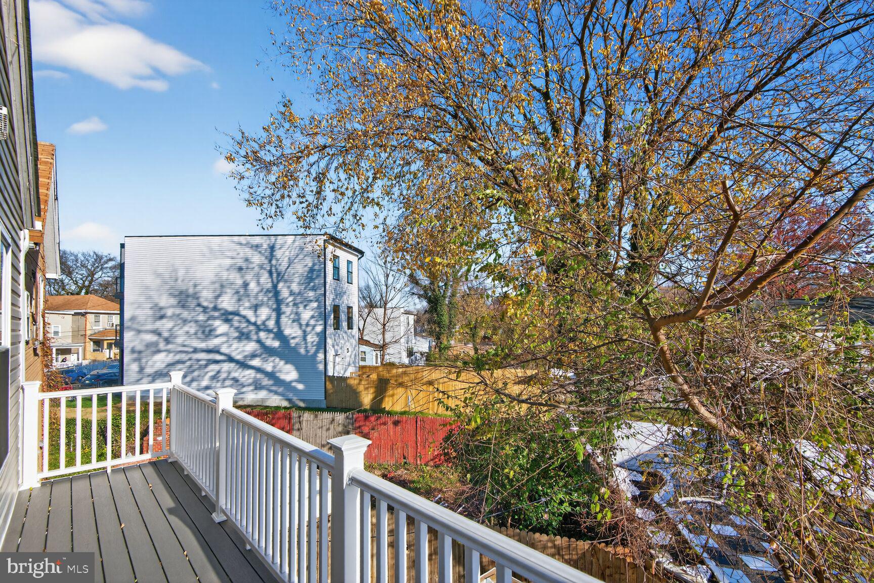 4321 Minnesota Avenue Northeast Washington, DC 20019 - Photo 23 of 24 a view of a balcony with wooden fence