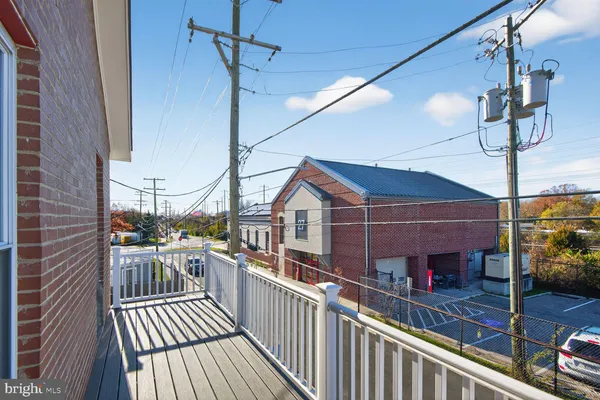a view of a balcony with car parked
