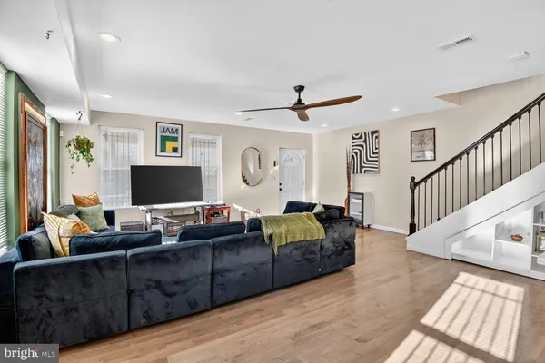 a living room with furniture and a flat screen tv