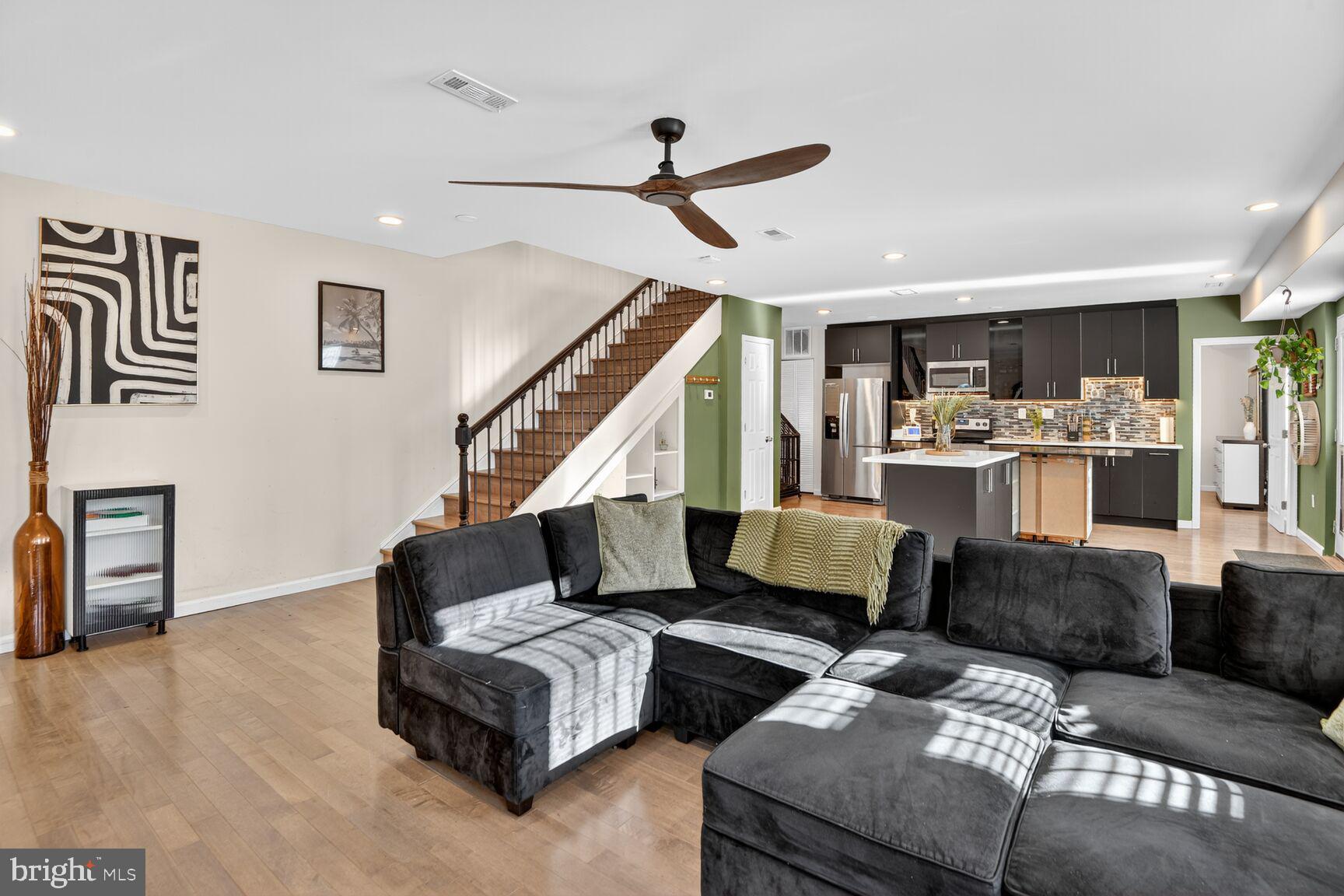 4321 Minnesota Avenue Northeast Washington, DC 20019 - Photo 3 of 24 a living room with furniture and wooden floor