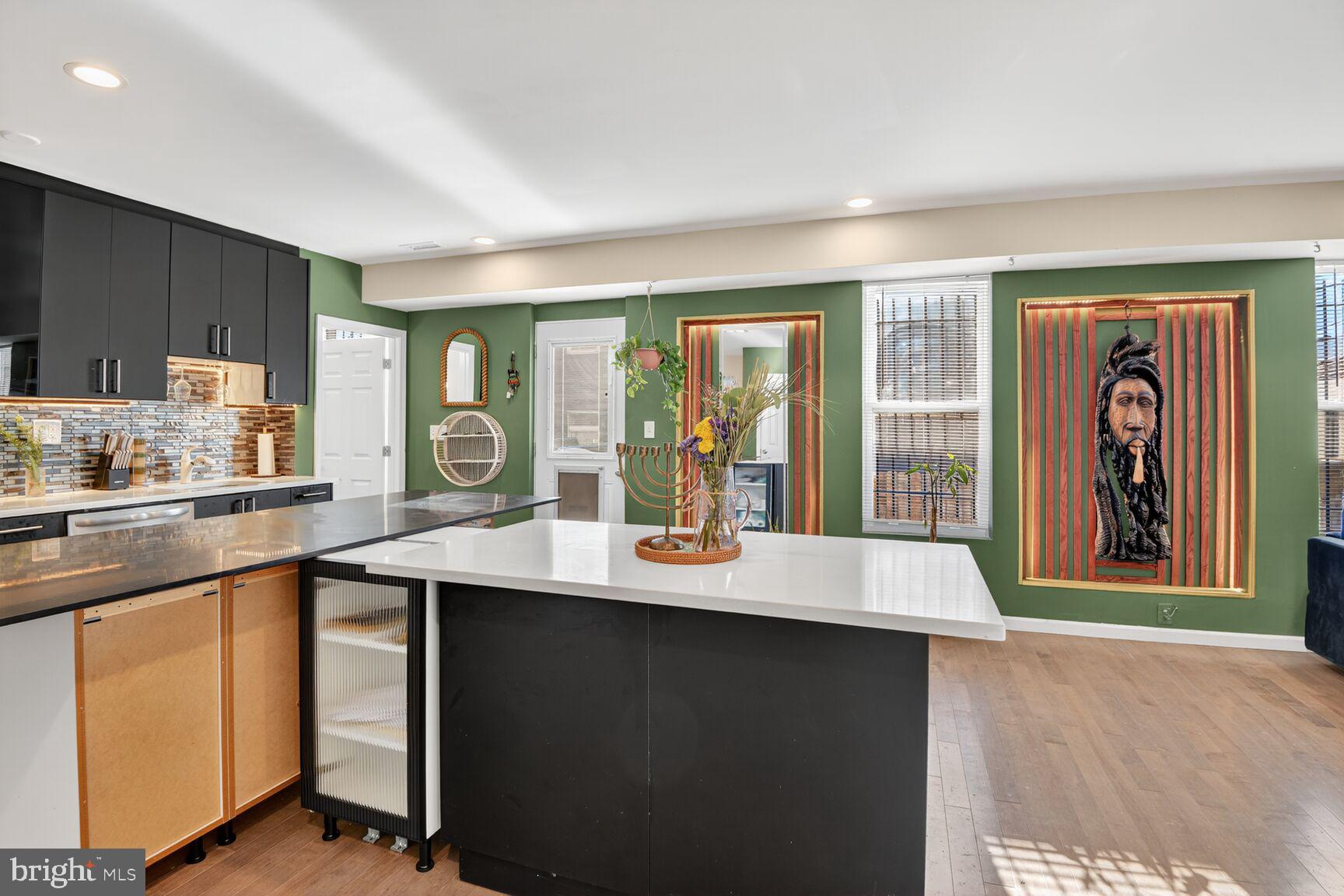 4321 Minnesota Avenue Northeast Washington, DC 20019 - Photo 9 of 24 a kitchen with a sink a window and chairs