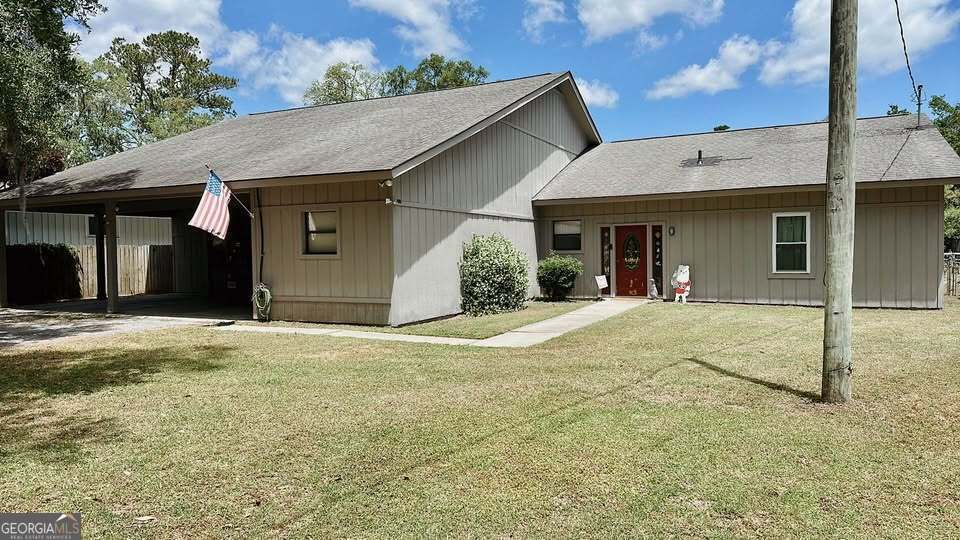 360 Island Road Savannah, GA 31406 - Photo 1 of 1 a view of a white house with a patio