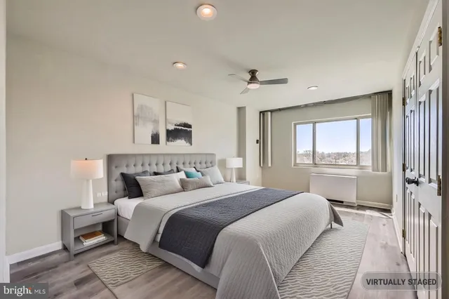 a bathroom with a granite countertop sink mirror and a shower