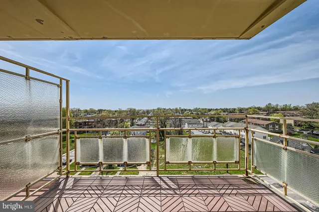 a view of a balcony with wooden floor