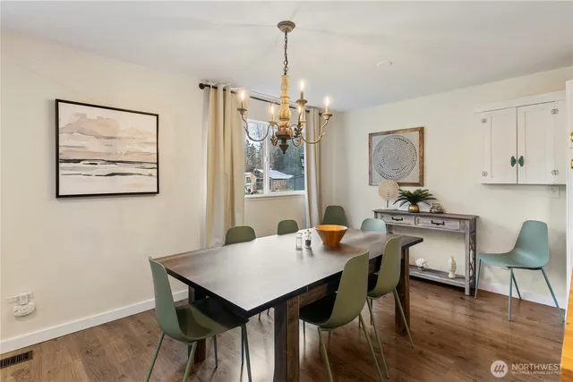 a bedroom with two beds and a window