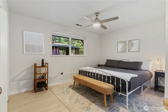 a bedroom with a bed and a dresser