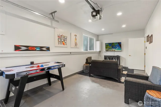 a living room with furniture and a piano