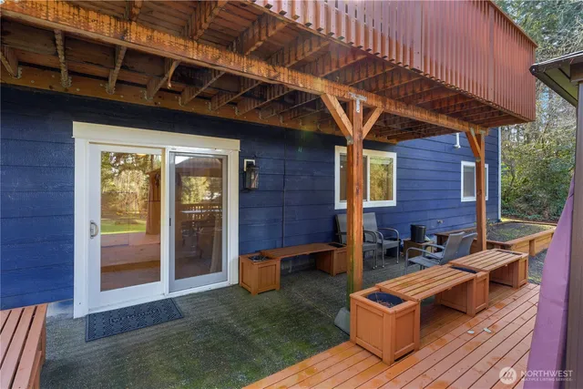 a view of balcony with wooden floor and outdoor seating