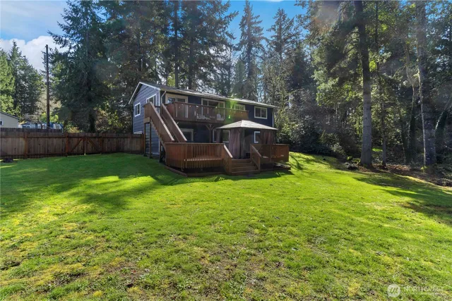 a view of a two chairs in the balcony