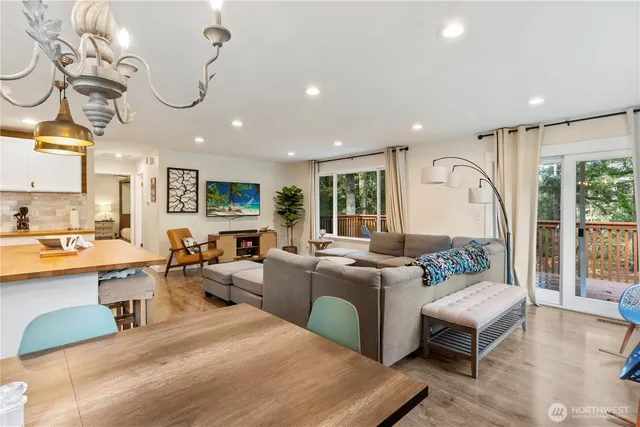 a living room with fireplace furniture and a wooden floor
