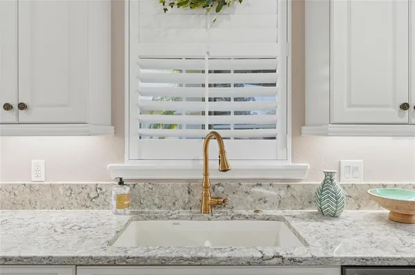 a kitchen with a sink stove and refrigerator