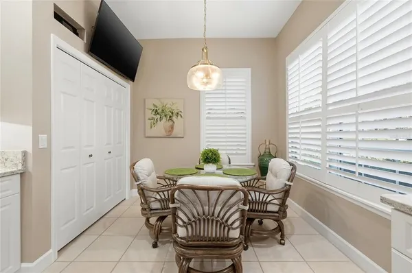 a bedroom with a bed wooden floor and couch