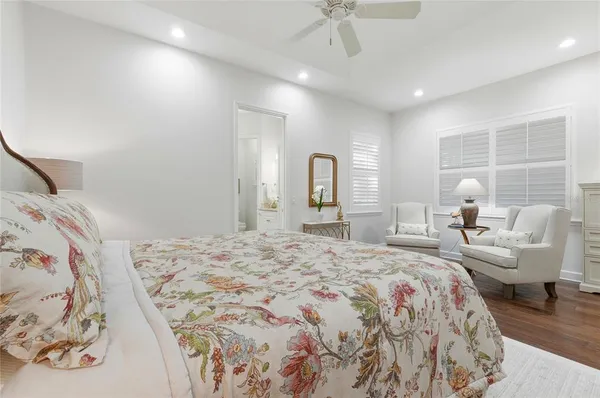 a bedroom with a bed and a couch