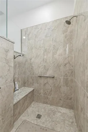 a bathroom with a granite countertop sink a toilet and a mirror