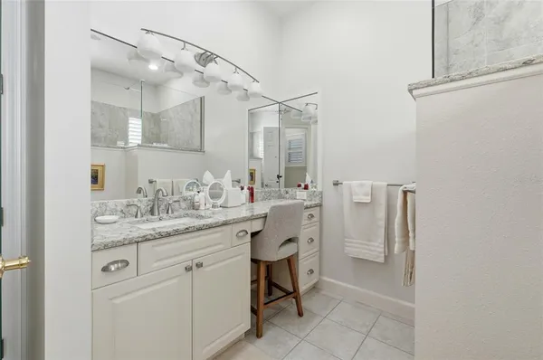 a bathroom with a shower and a window