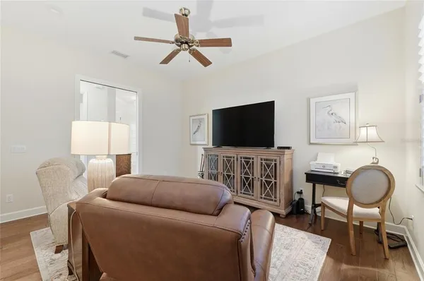 a living room with furniture and a window