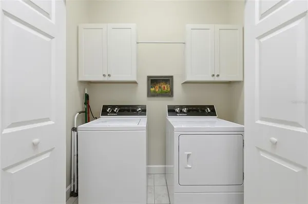 a view of storage and utility room with washer and dryer
