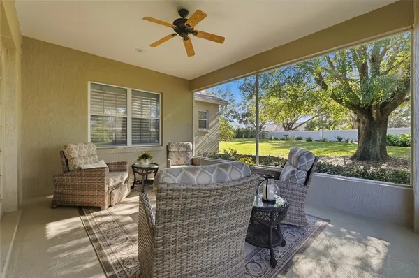 a backyard of a house with yard and outdoor seating