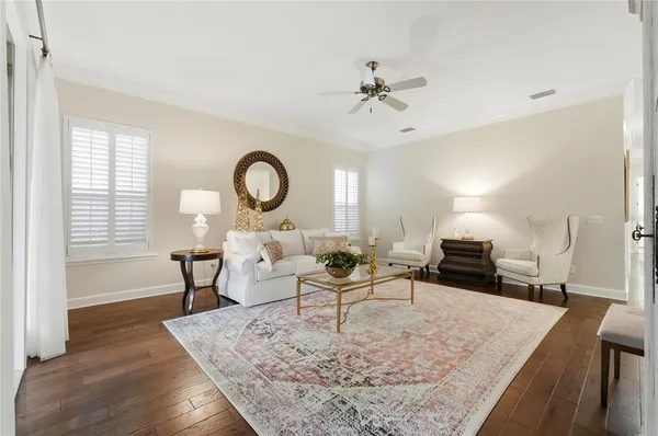 a kitchen with a refrigerator sink and white cabinets