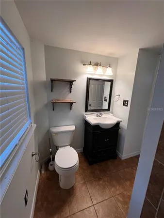 a bathroom with a shower and toilet