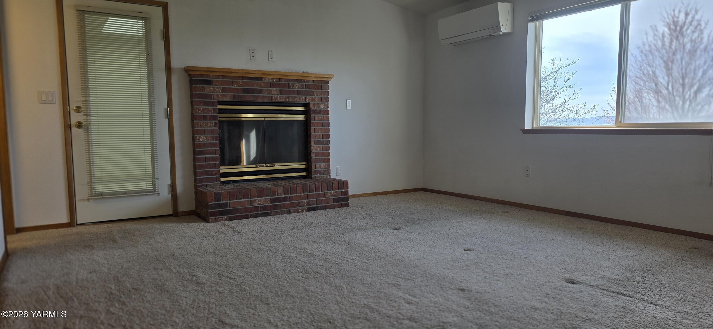 8601 Scenic Drive Yakima, WA 98908 - Photo 33 of 52 an empty room with windows and fireplace