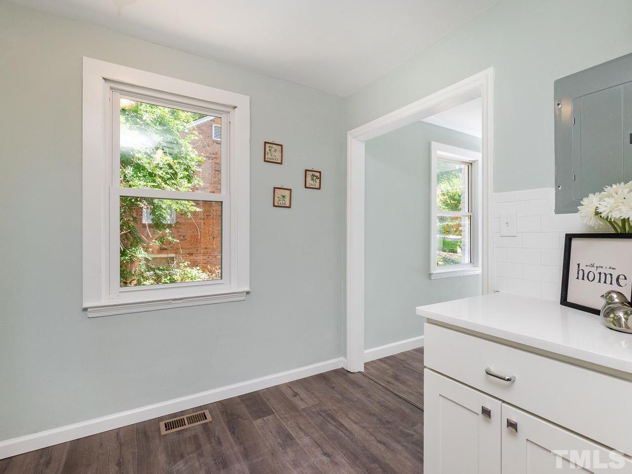 332 Angier Avenue Raleigh, NC 27610 - Photo 14 of 30 a room with window and wooden floor
